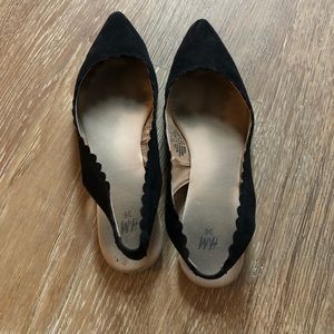 Black slip on flats with scalloped back